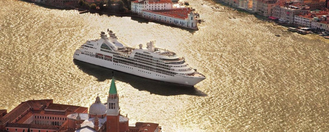 Seabourn ship sailing down a river