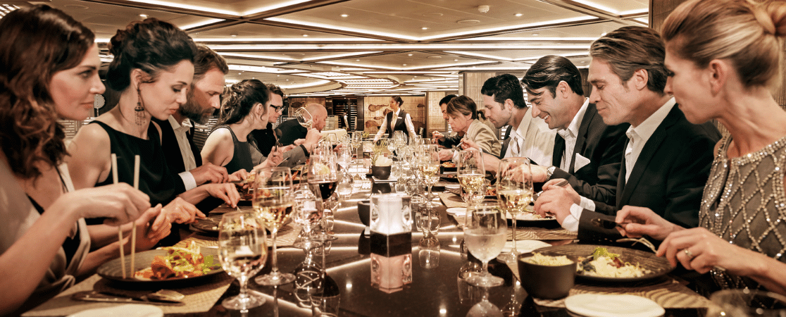 Bustling table of diners on board a Silversea Cruise Ship